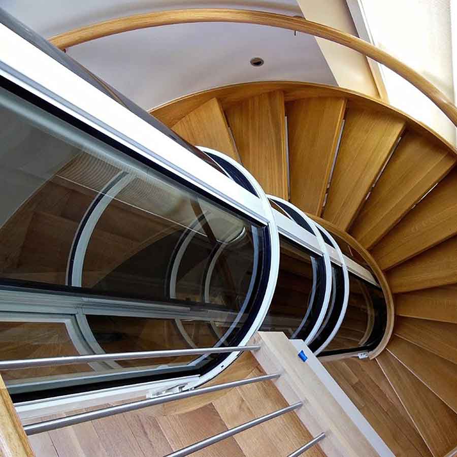 round elevator installed inside spiral staircase